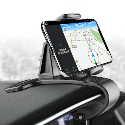 Black universal car phone holder with 360-degree rotating head on a car dashboard.