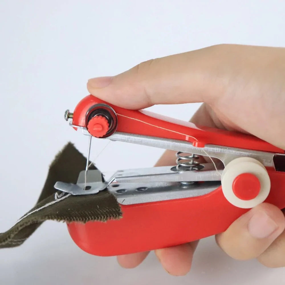 Small blue hand-held manual sewing machine showing stainless steel components and compact 11cm design