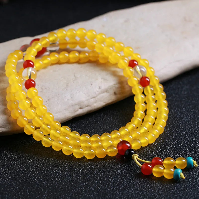Women's crystal necklace with 108 geometric beads and lucky cat charms