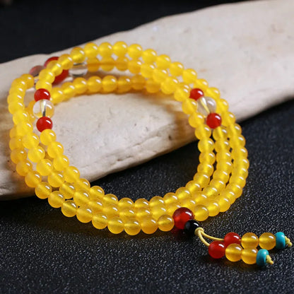 Women's crystal necklace with 108 geometric beads and lucky cat charms