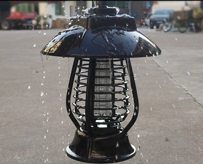 White and black solar-powered electronic mosquito lamp for garden outdoor insect control.