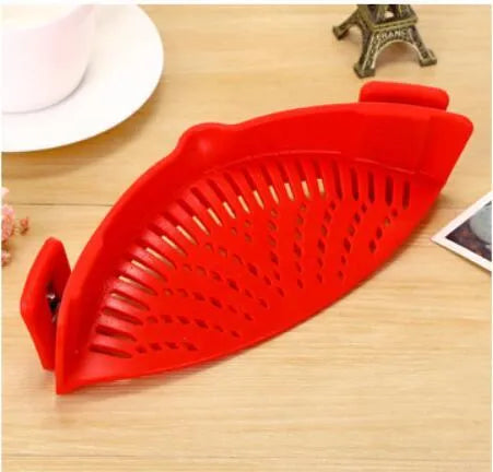 Silicone clip-on kitchen strainer with stainless steel frame attached to pot rim