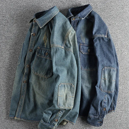 Men's light blue washed vintage denim shirt with long sleeves and a loose cardigan fit.