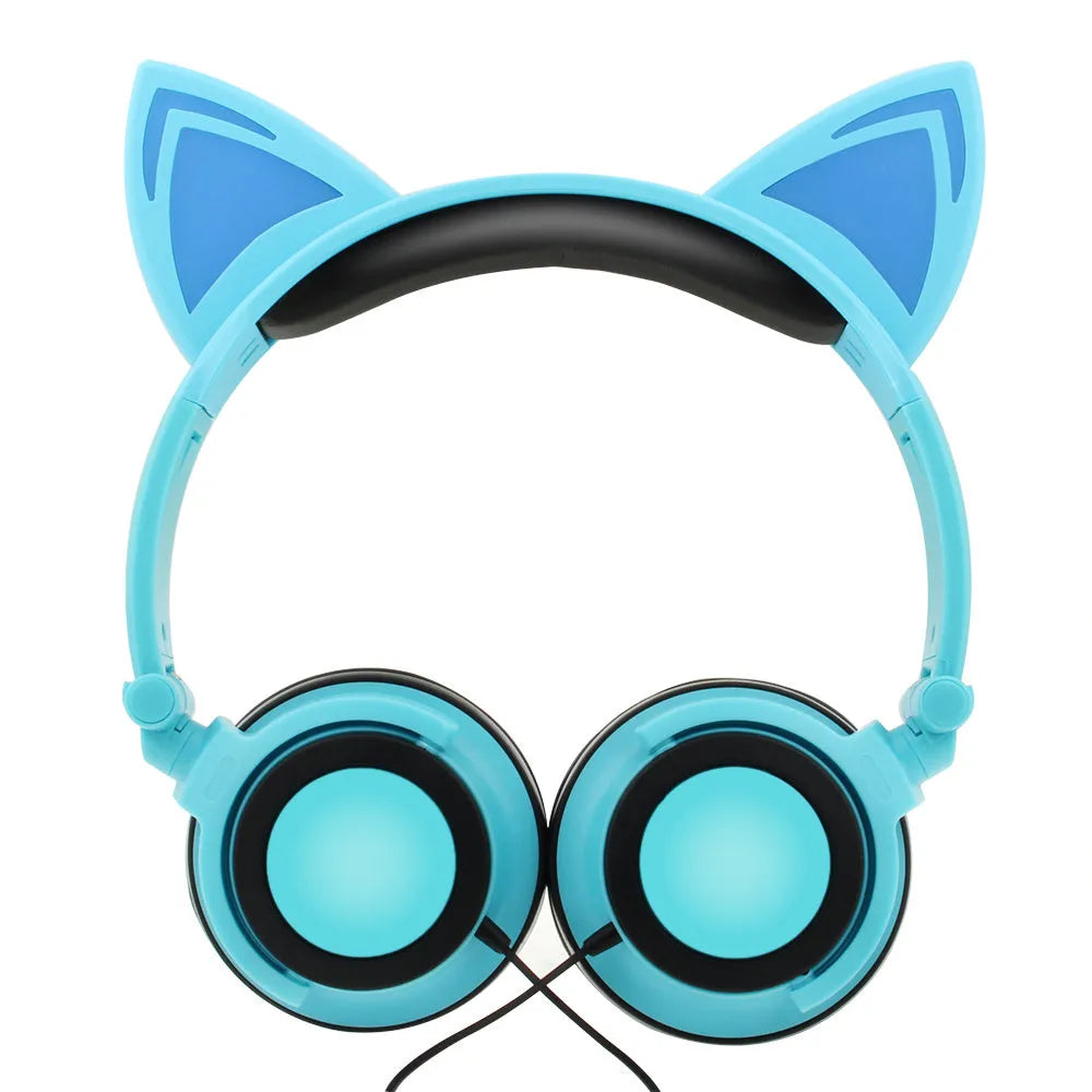 Colourful LED cat ear headphones with illuminated ears and cushions on a black background