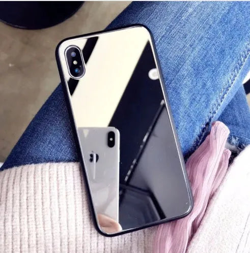 Black iPhone mirror phone case with built-in self-timer glass, compatible with iPhone 7 Plus, 8 Plus, and X models.