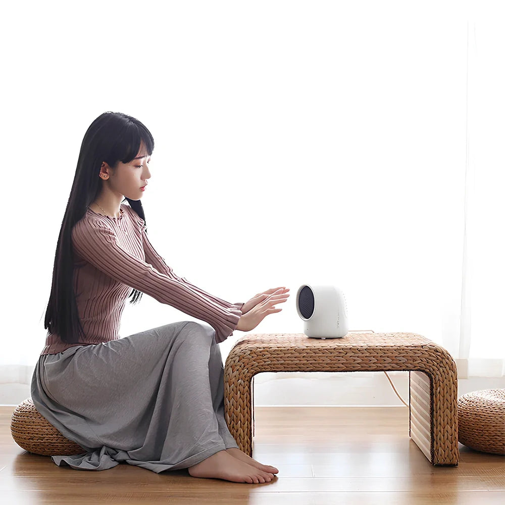 Compact brown mini home heater measuring 155mm tall with UK plug, placed on wooden desk