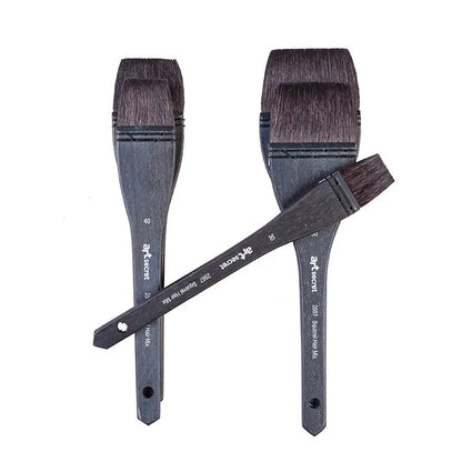 Grey squirrel hair makeup brush with a wooden handle on a plain background