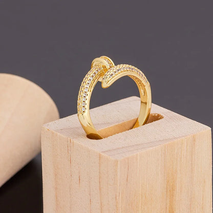 Personalized nail ring in gold with geometric metal design and inlaid drill detail, adjustable opening