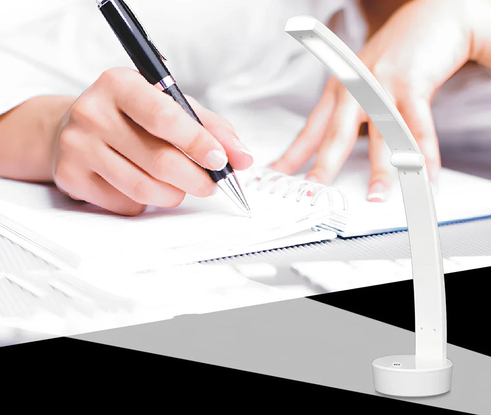 White folding LED desk lamp with touch control on wooden desk