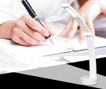 White folding LED desk lamp with touch control on wooden desk