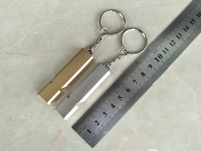Outdoor survival whistle with keychain in gold and silver options