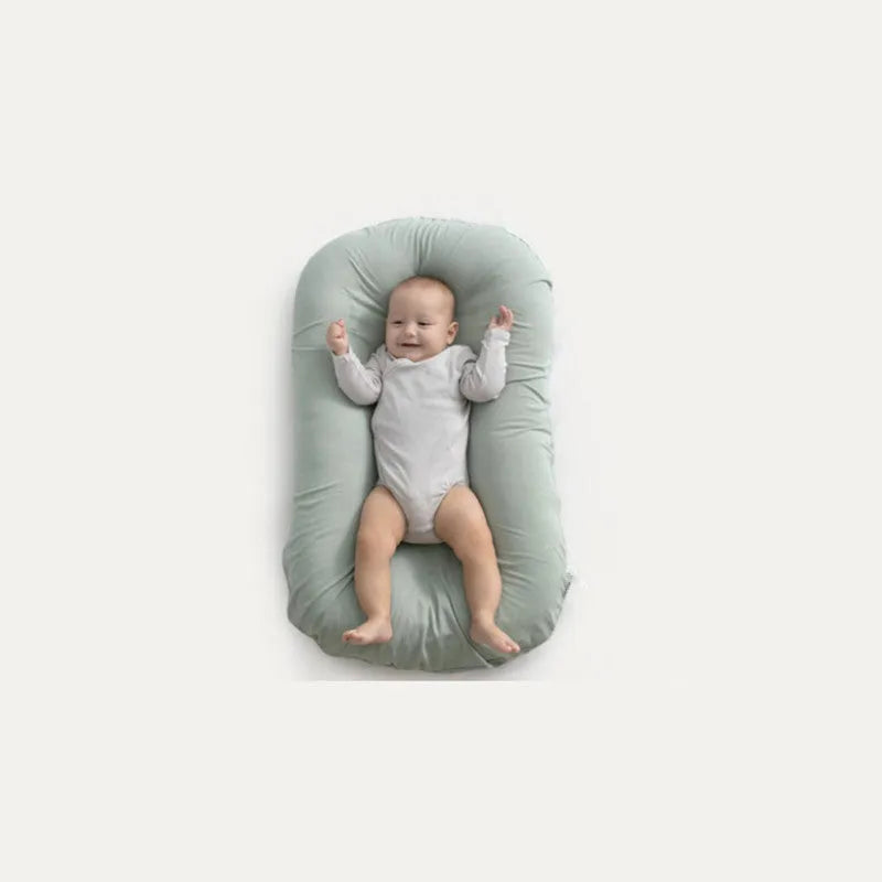Beige portable cotton baby nest crib measuring 75 by 45 centimetres for newborn infants