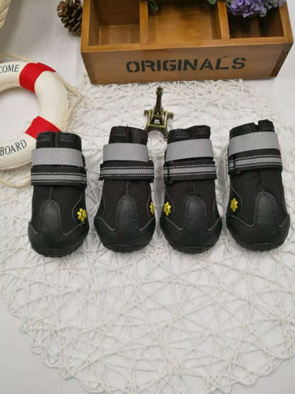 Black waterproof dog shoes with non-slip soles and adjustable fuzzy belts