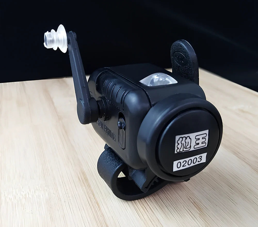 Black sea fishing bite alarm with ABS shell and polymer mounting belt for rod attachment