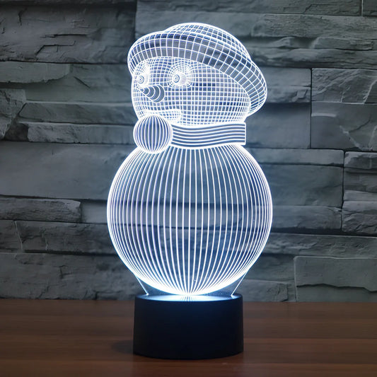 Christmas snowman 3D LED light with colourful acrylic shade measuring 20.8cm tall on wooden surface