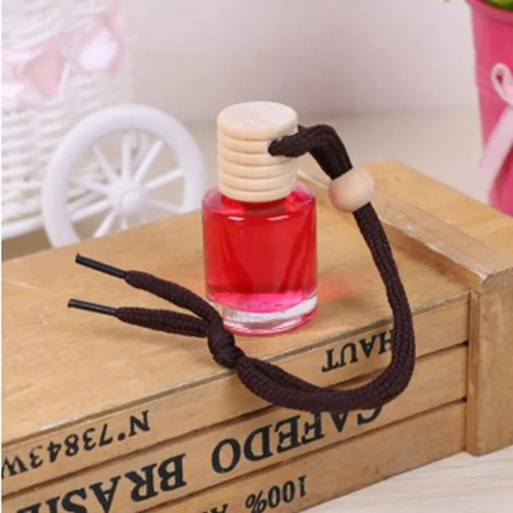Glass bottle car air freshener hanging ornament with six scent options including lavender, lemon and apple