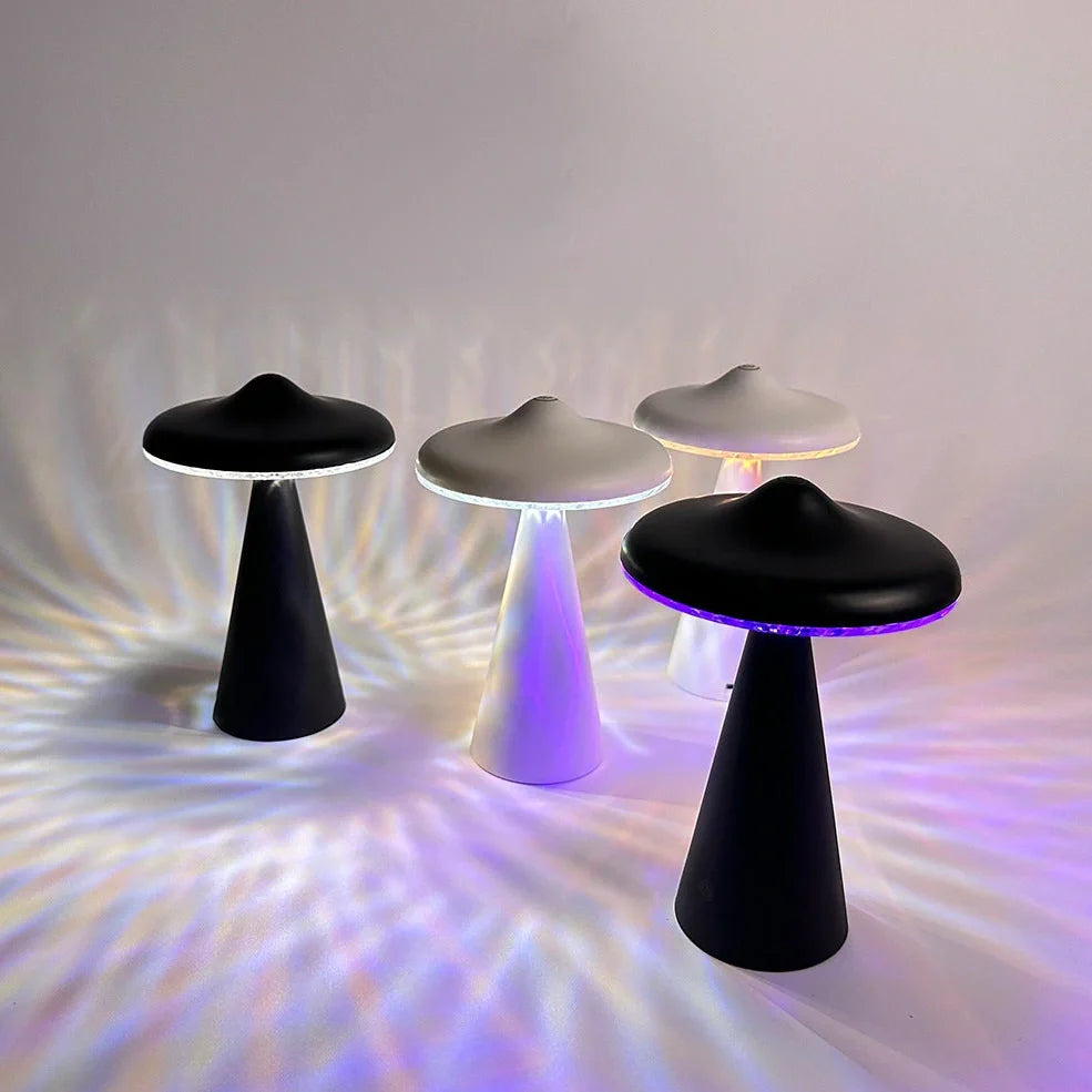 Black or white UFO-shaped night light with USB charging port and LED illumination