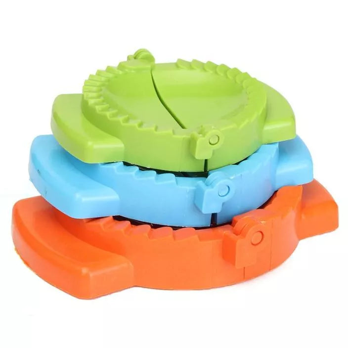 Plastic dumpling maker device in blue, green, and white for quick, uniform dumplings