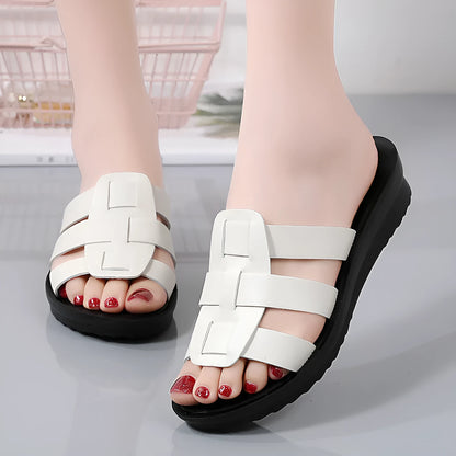 Women's large size flat bottom slippers in beige, black and brown colours with PU leather construction
