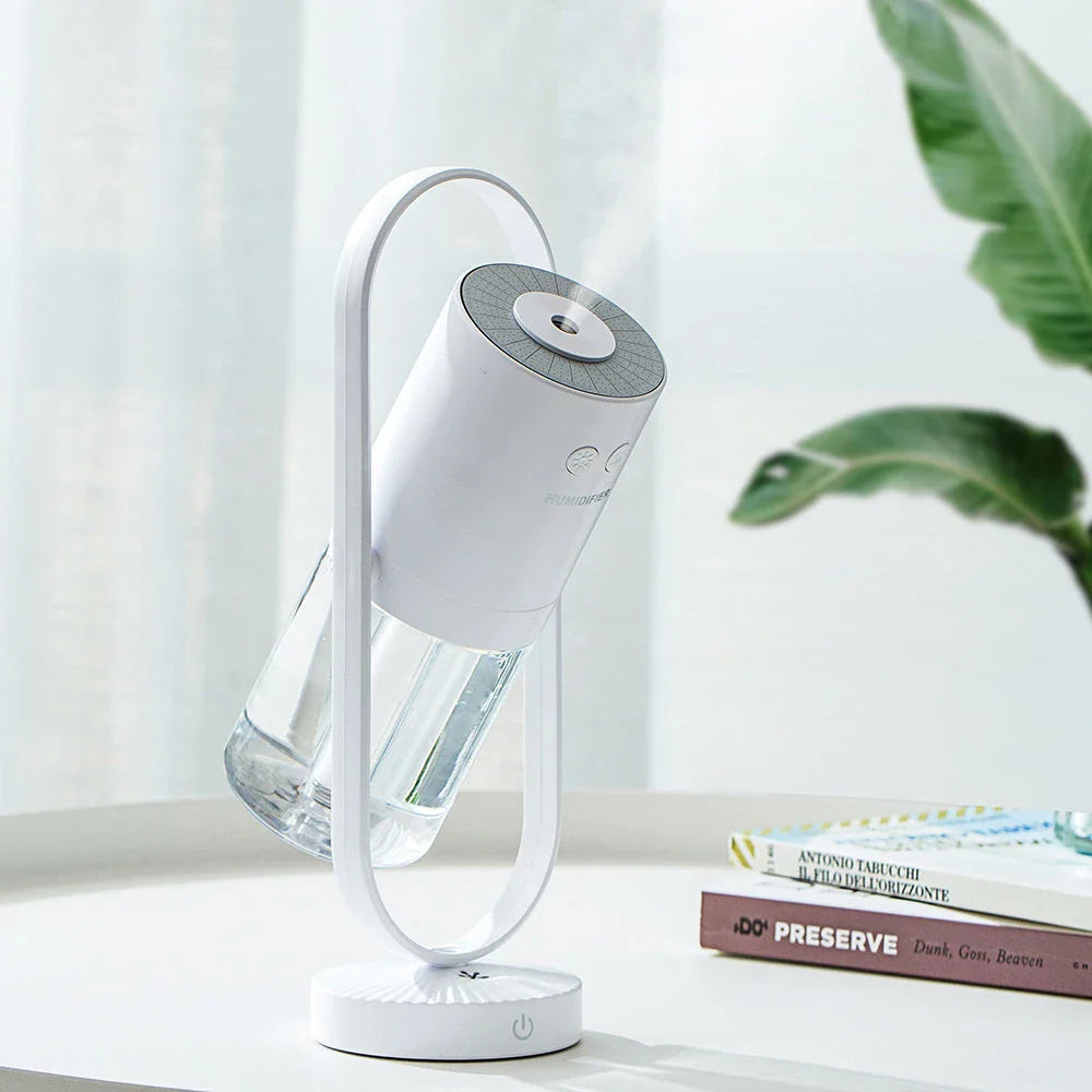 Compact desktop humidifier with starry projection feature, designed to improve air moisture and create a relaxing ambiance.