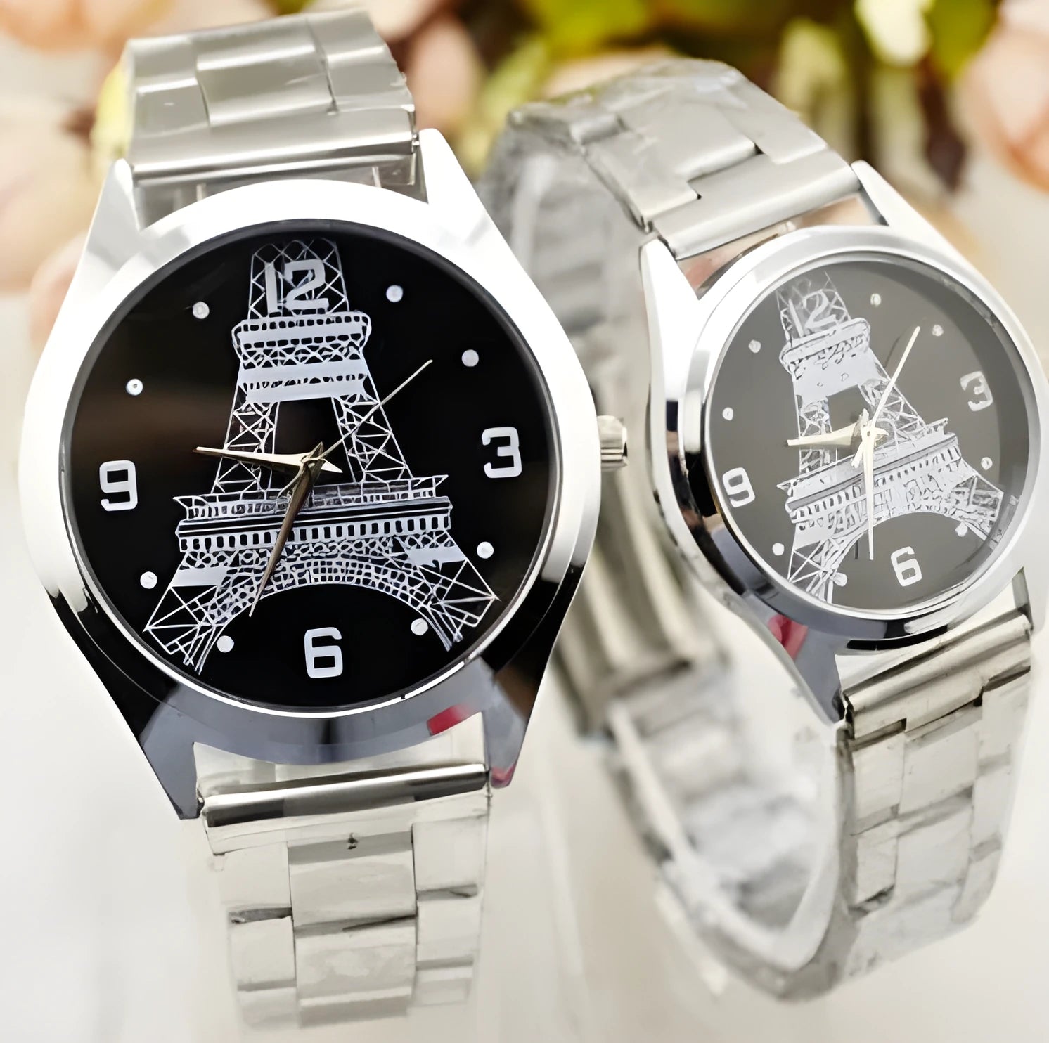 Silver tone Eiffel Tower wrist watch with round dial and luminous hands