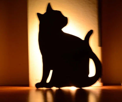 Assorted animal-shaped night lights with motion sensor, including a walking cat, mother and child cat, licking cat, looking back cat, and Pikachu