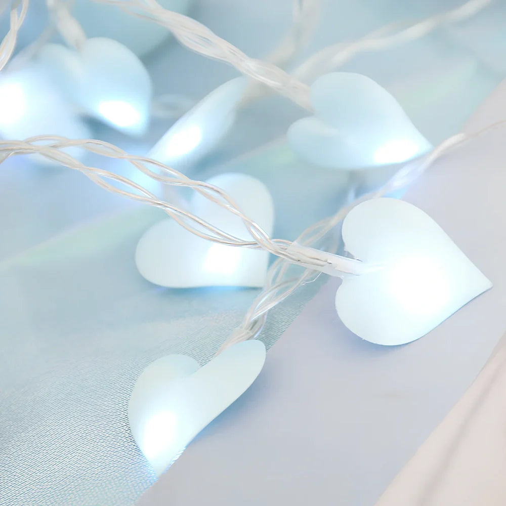 LED string lights with fabric heart elements in pink or blue colour options