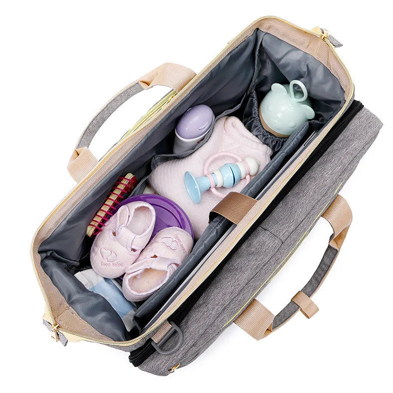 Portable folding crib mummy bag showing 40x19x32cm dimensions with Oxford cloth exterior