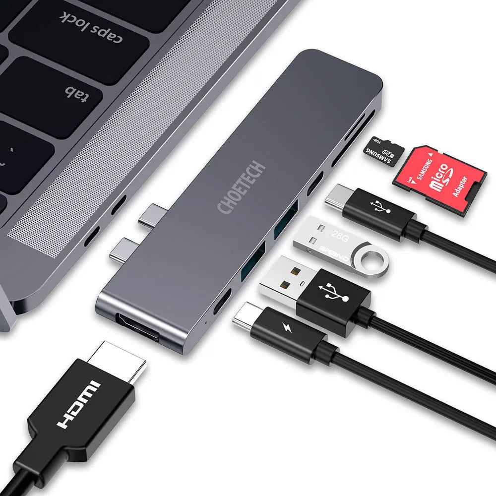 Black aluminium alloy USB C adapter with SD card slot, Thunderbolt 3, HDMI, and USB ports