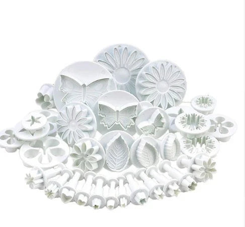 A set of premium cake decorating tools including plungers and knives for creating beautiful flower and shape designs on cakes and baked goods