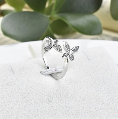 Adjustable sterling silver ring with intricate butterfly design, ideal for everyday wear or special occasions.
