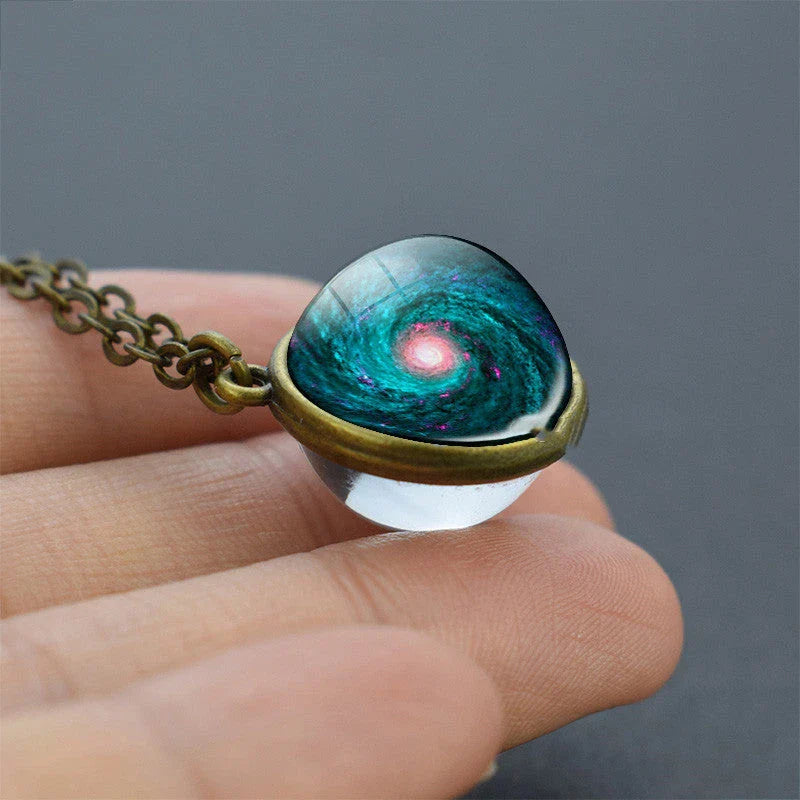 Mesmerizing double-sided galaxy pendant necklace in various celestial patterns and colors