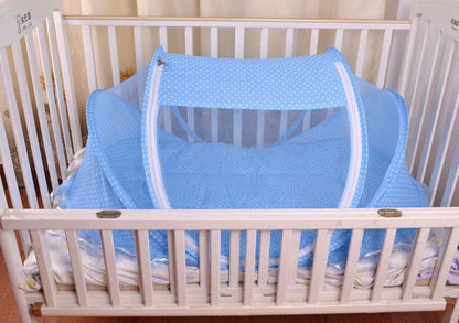 Portable foldable baby bed net with built-in mattress and pillows, perfect for travel and outdoor activities