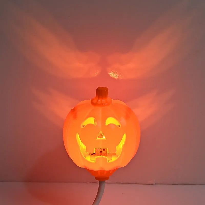 Plastic pumpkin decorative lamp with USB cable, available in purple or yellow light, measuring 22cm tall
