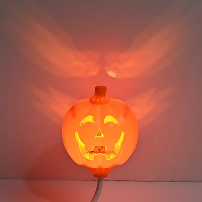 Plastic pumpkin decorative lamp with USB cable, available in purple or yellow light, measuring 22cm tall