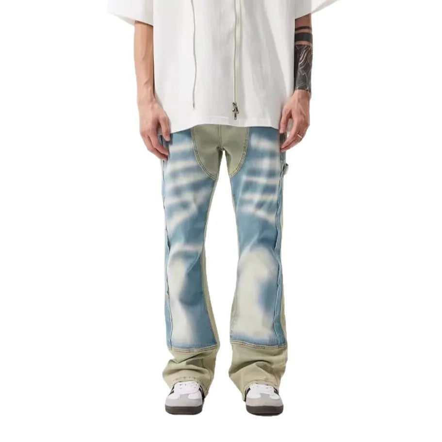 Yellow and blue patchwork splash-ink damaged design denim jeans with mid-waist cut and zip placket closure