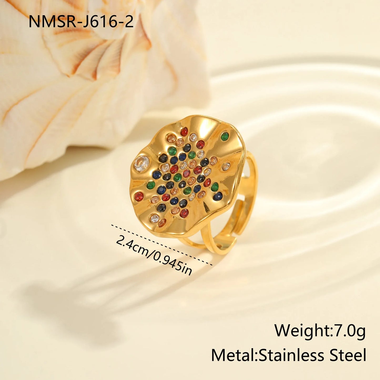 Pleated geometric open mouth ring made from stainless steel with colourful crystal inlay on a hand.