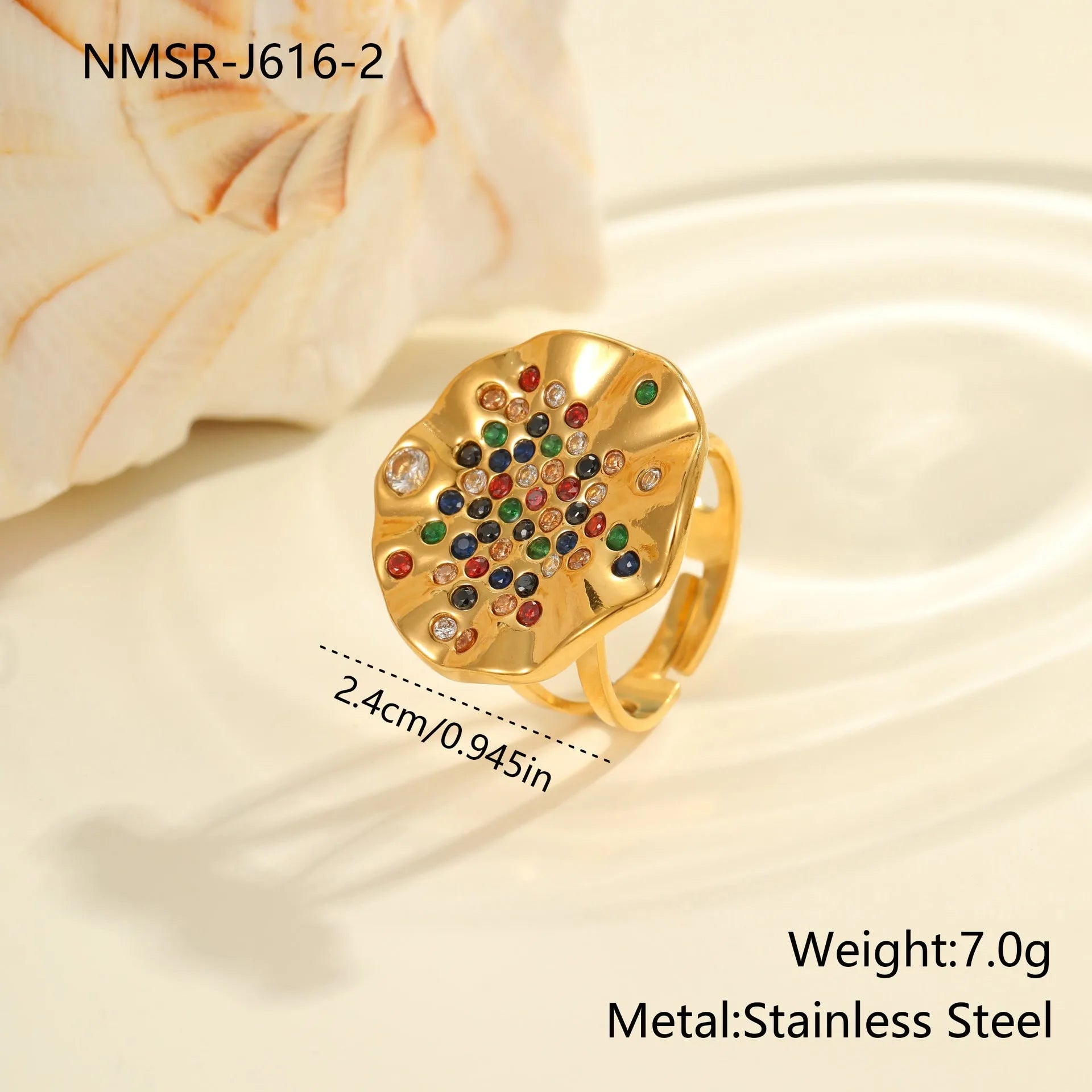 Pleated geometric open mouth ring made from stainless steel with colourful crystal inlay on a hand.