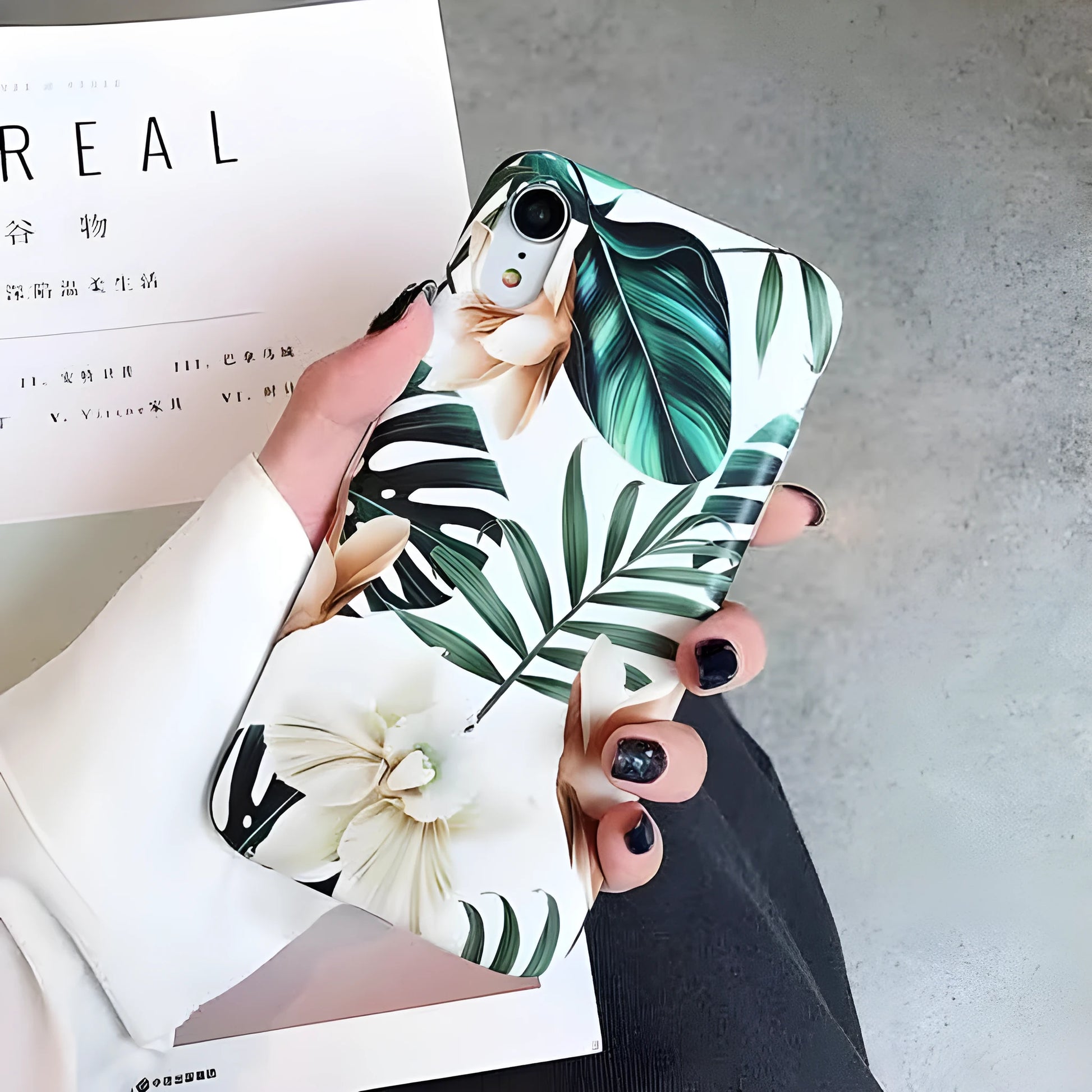 Retro floral iPhone case with banana leaf and flowers design in leaves colour on a soft TPU back cover.