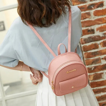 Small women's shoulder backpack in solid colour with zipper closure, dimensions 18.5cm x 8cm x 21cm