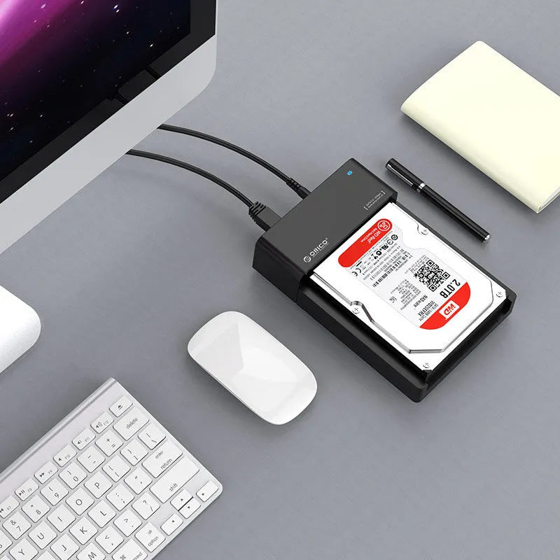Black universal 2.5-inch SATA hard disk box with data cable for portable external storage