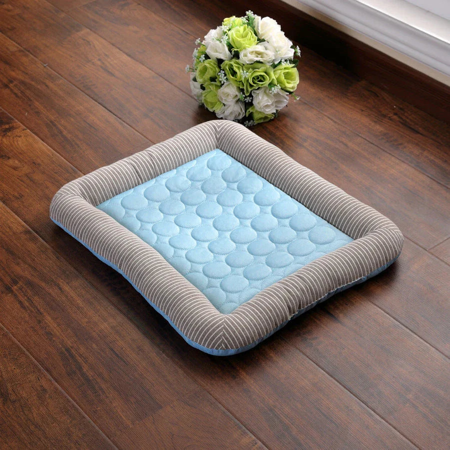 A plush, breathable cooling pet bed in blue and red colors, designed to keep dogs and cats comfortable in the summer heat.