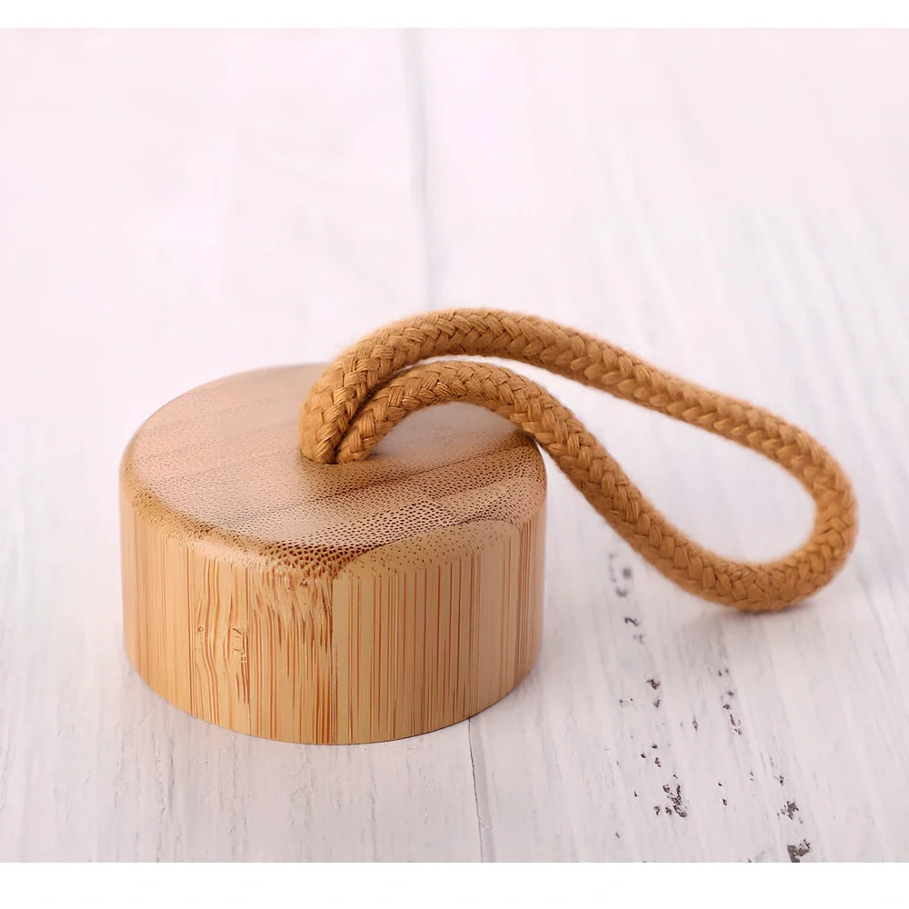 Crystal infused glass water bottle with bamboo lid showing mineral crystal inside 25cm tall container