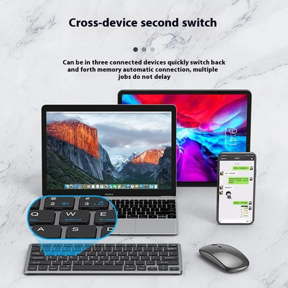Black ultra-thin wireless keyboard and mouse combo with USB receiver and keyboard cover on a desk.