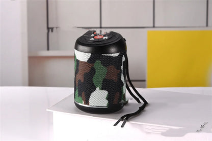 Portable outdoor Bluetooth subwoofer speaker in multiple colours showing button controls.