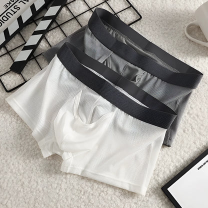 Men's ice silk boxer briefs in black, white, and grey colours showing mesh fabric and low-waist design