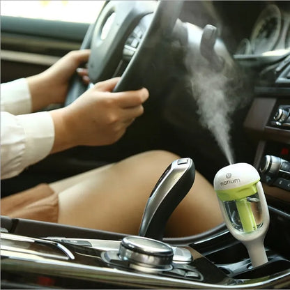 Portable car humidifier unit showing compact design with rotation capability for vehicle use