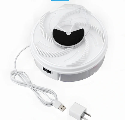 USB electric fly trap in white with blue accents, showing five bait grooves and rotating capture plate for insect control