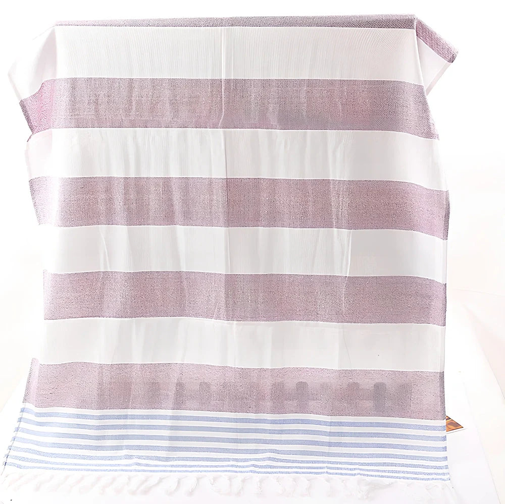 Striped Turkish beach towel showing blue and white pattern, measuring 100cm by 180cm