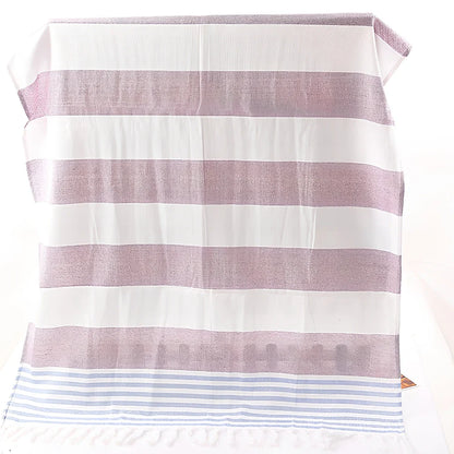 Striped Turkish beach towel showing blue and white pattern, measuring 100cm by 180cm